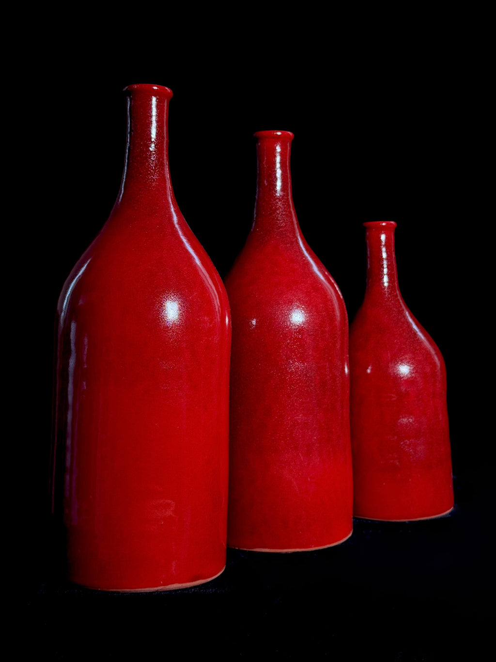 Bouteilles en poterie - Trio rouge vif
